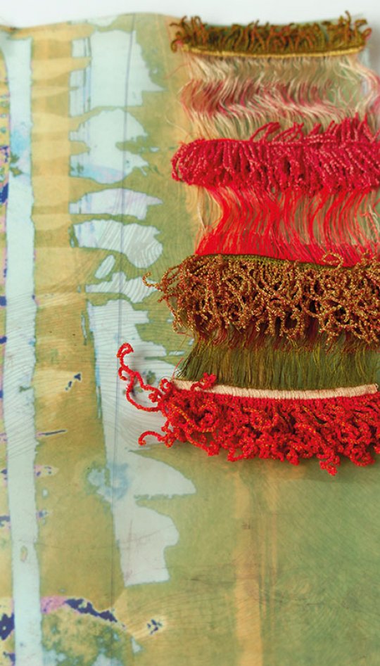 Textiles sample with red and gold texture
