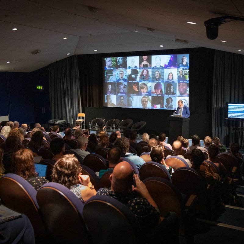 An audience of people in an auditorium