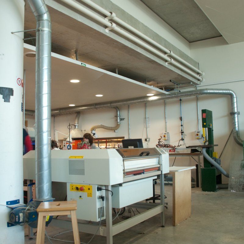 Students working in facilities with large machinery