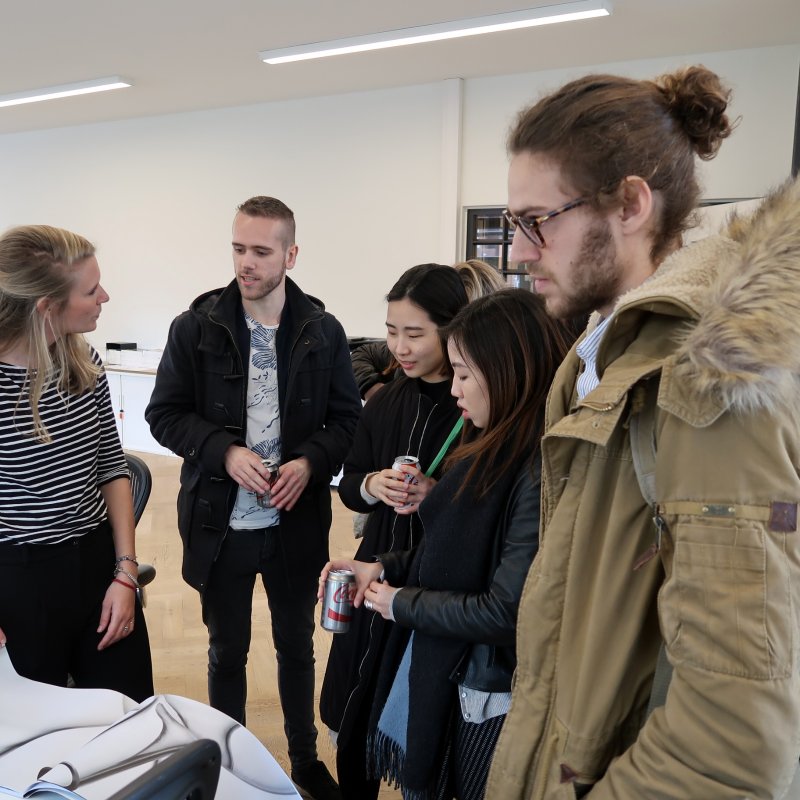 Group of students looking at work 