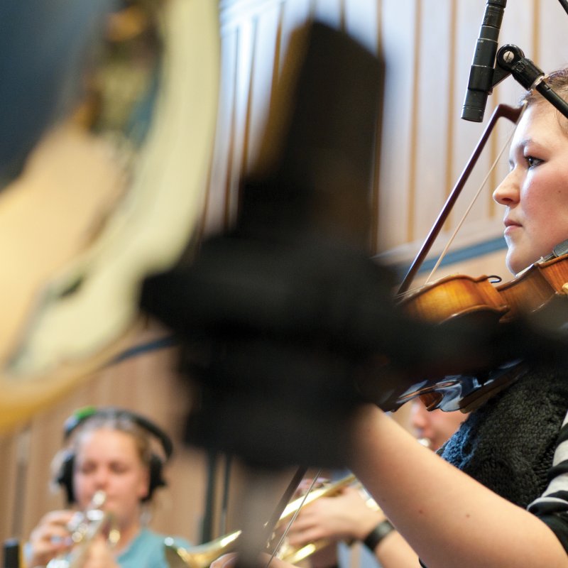 Group of students playing brass instruments.