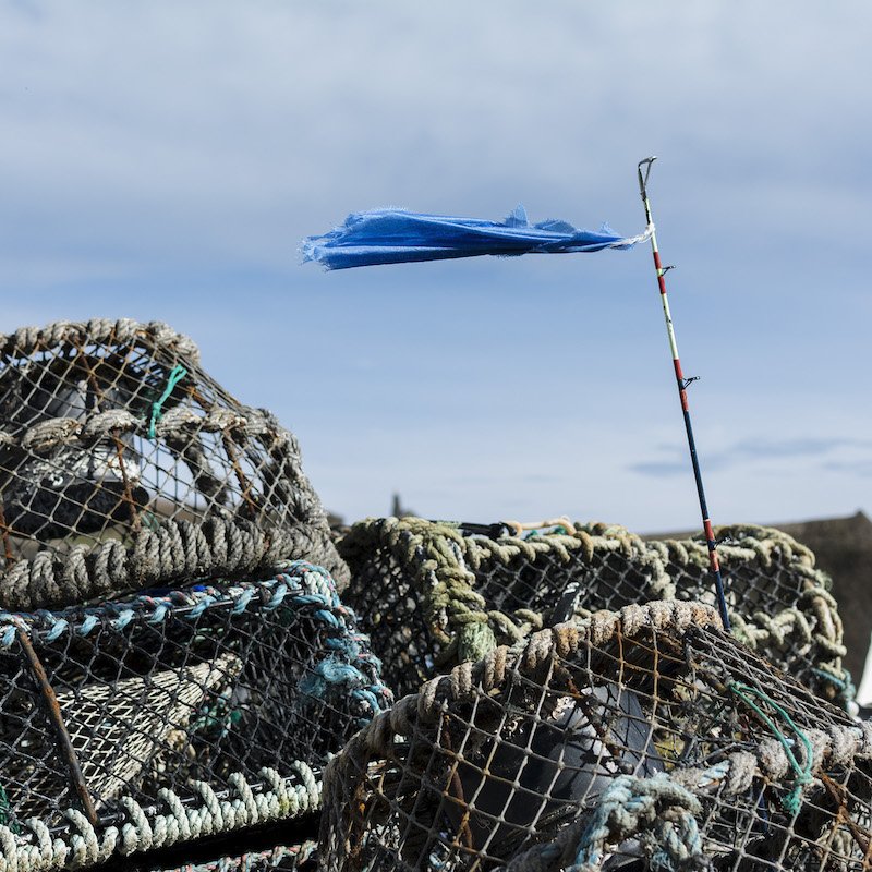 lobster pots and a blue flag