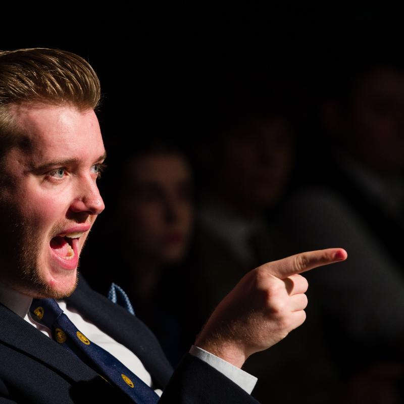 A Falmouth acting student with his mouth open while pointing