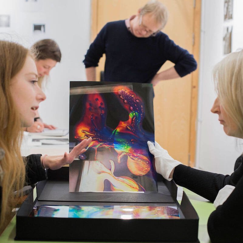 Falmouth Photography student and lecturer discussing work.