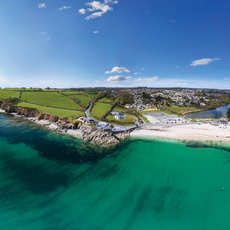 Aerial View Of Swanpool Beach with sea and cliffs