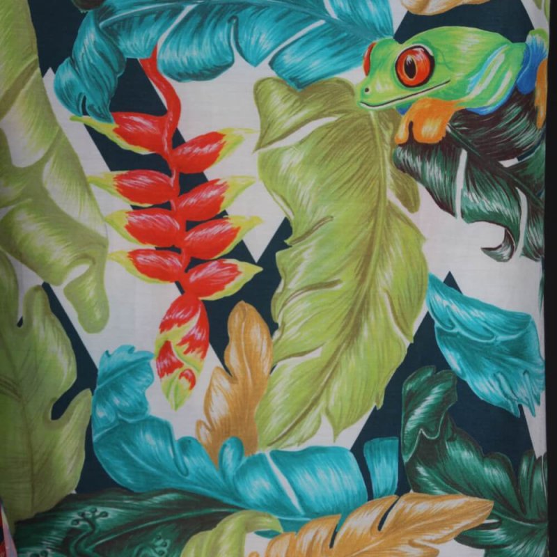 Tropical printed fabric with a red eyed frog.
