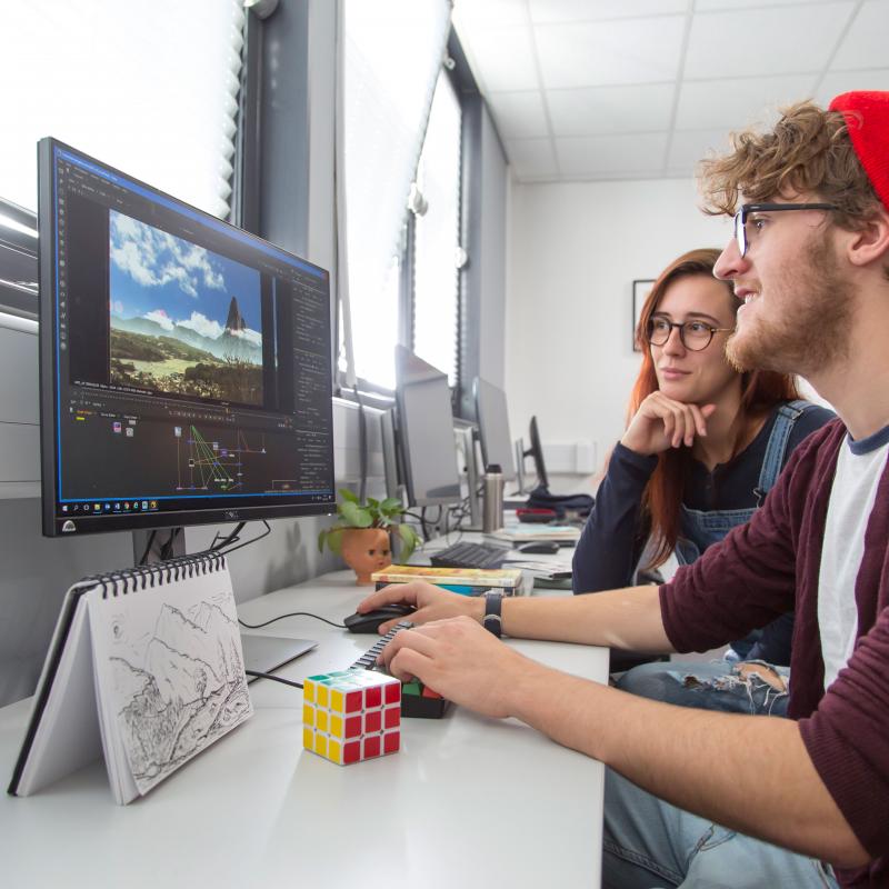 Animation students creating a landscape on a computer