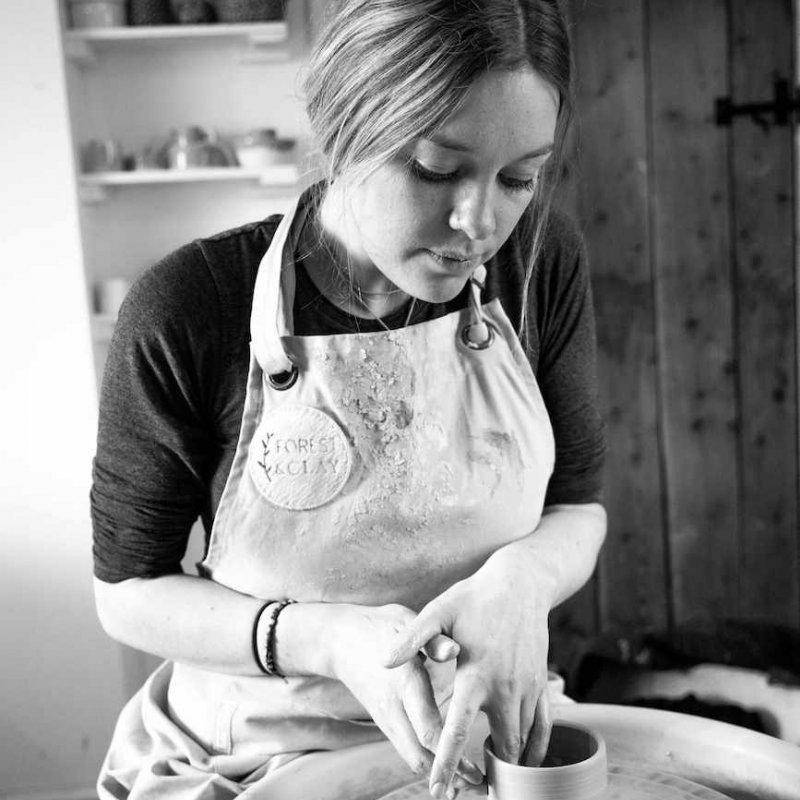 Falmouth University graduate, Anna Burnett throwing a pot on a wheel