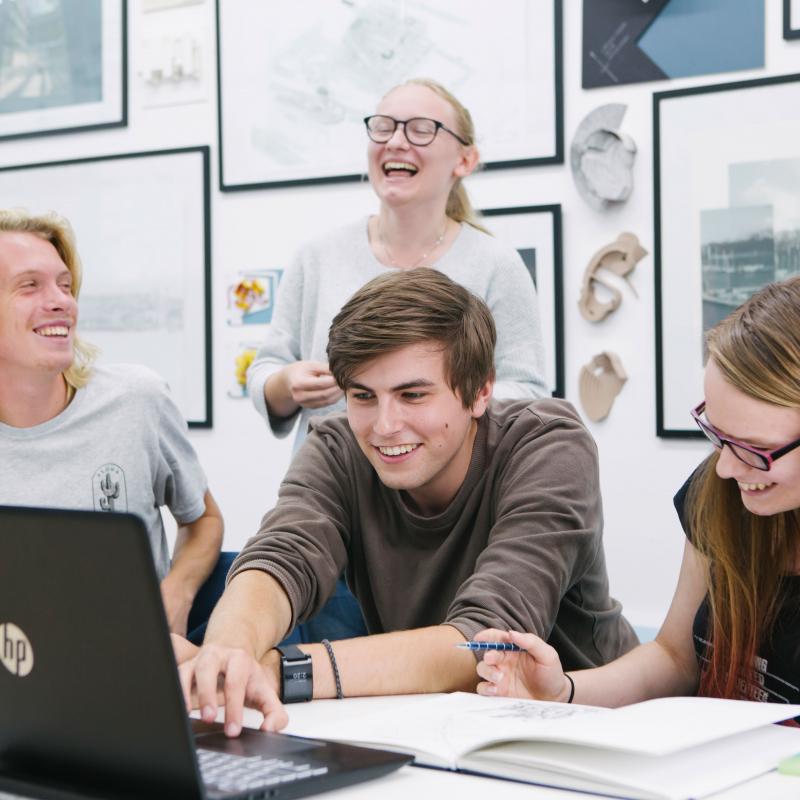Architecture students working together and laughing