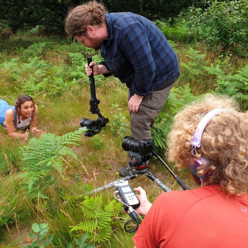 students filming outside