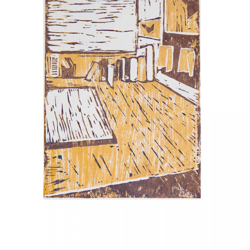 Linocut print in yellow and brown of room interior with books