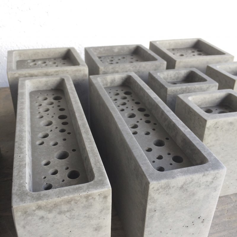 A group of Bee Bricks in grey
