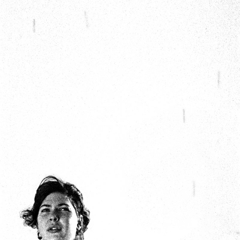 Female face looking into the distance with large white background