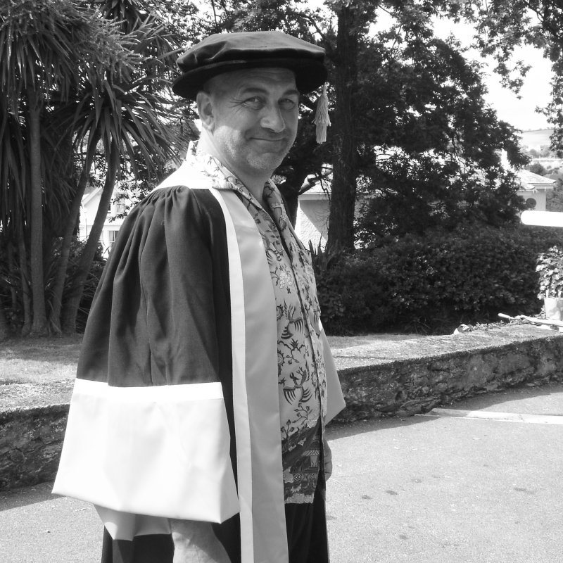 Falmouth honorary fellow Bill Mitchell in academic gown.
