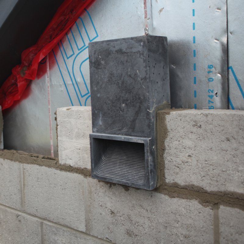 Wall of breeze blocks with bespoke brick laid in