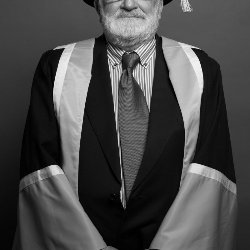 Falmouth honorary fellow Charles Hancock in academic gown.