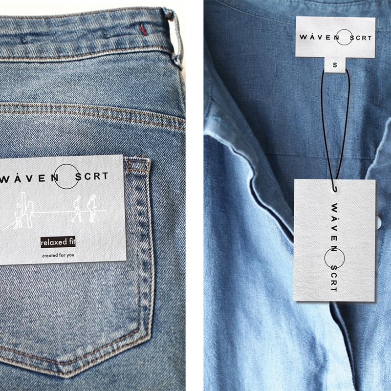 Detail of label on jeans back pocket and neck of denim shirt.