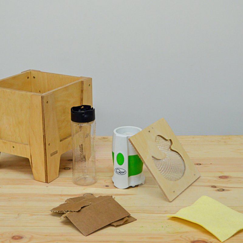 Wooden box with duck panel and a plastic bottle