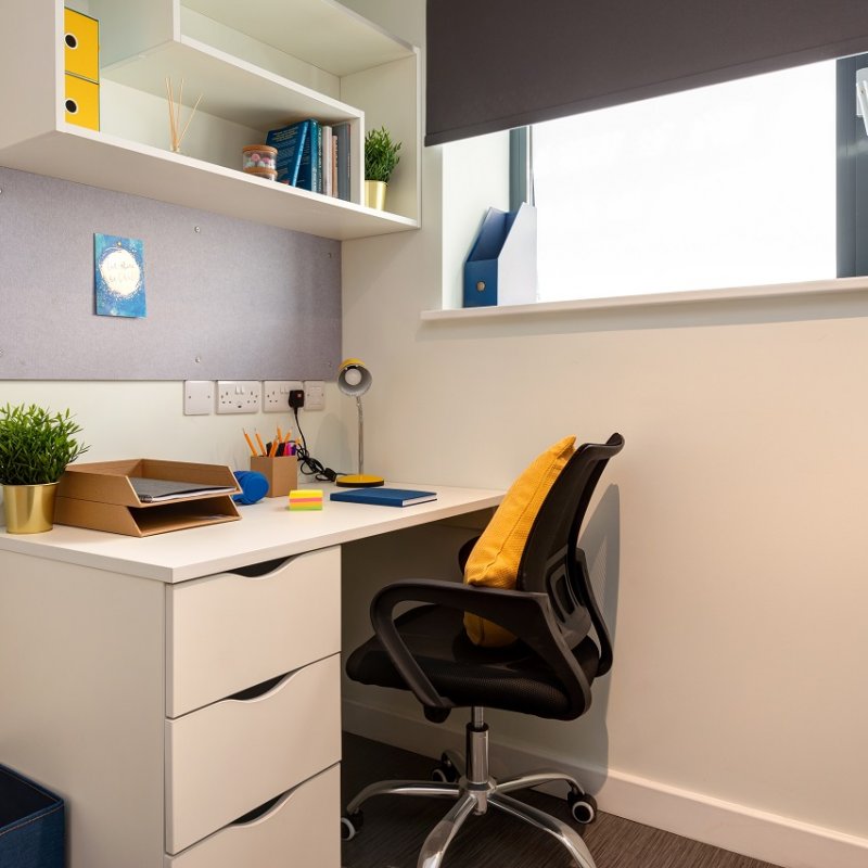 White desk and chair in a student room