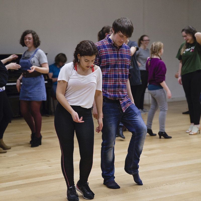 Falmouth University students learning latin dance moves.