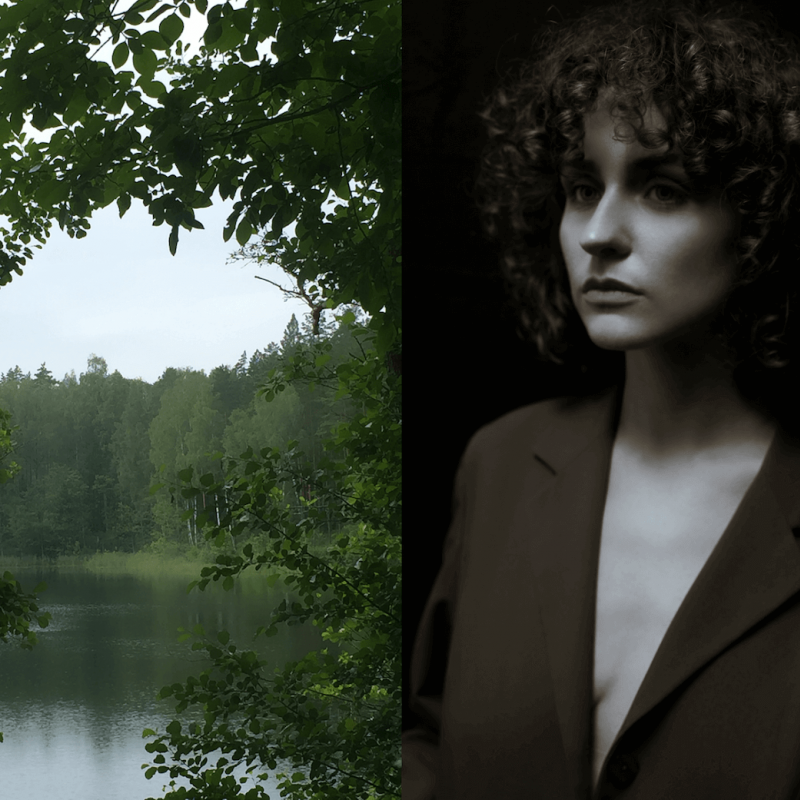 A woman in a brown jacket in front of trees and a lake