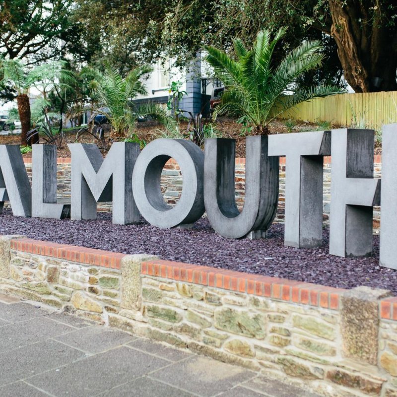 Concrete Falmouth letters sculpture at the top of the Woodlane campus.