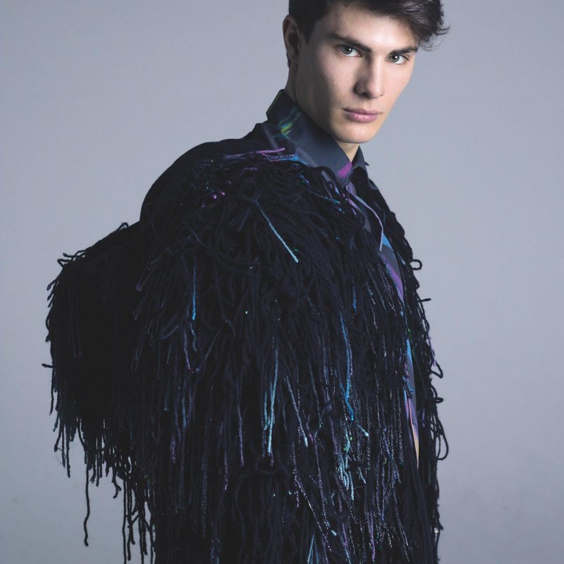 Models wearing dark blue shaggy jacket.