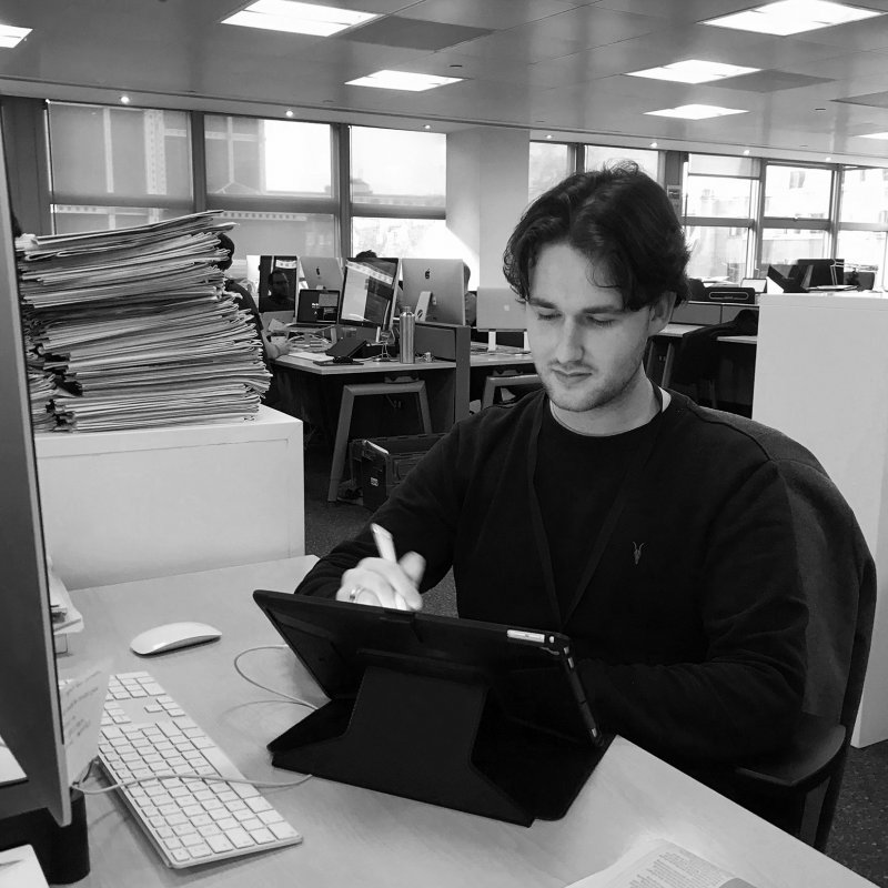 Illustration graduate Jake Hawkins at his desk