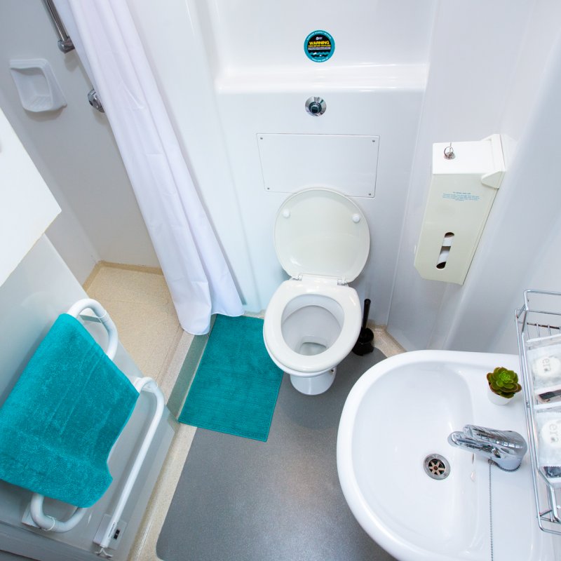 Ensuite bathroom with walk-in shower, heated towel rail, toilet and sink at Glasney Student Village 