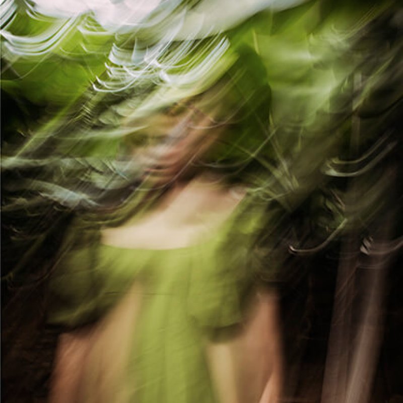 Long exposure of a woman in a green dress