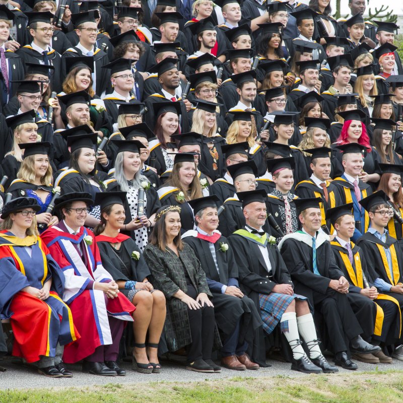 Chancellor, Dawn French, sat in the centre of the 2018 graduates having their photo taken.