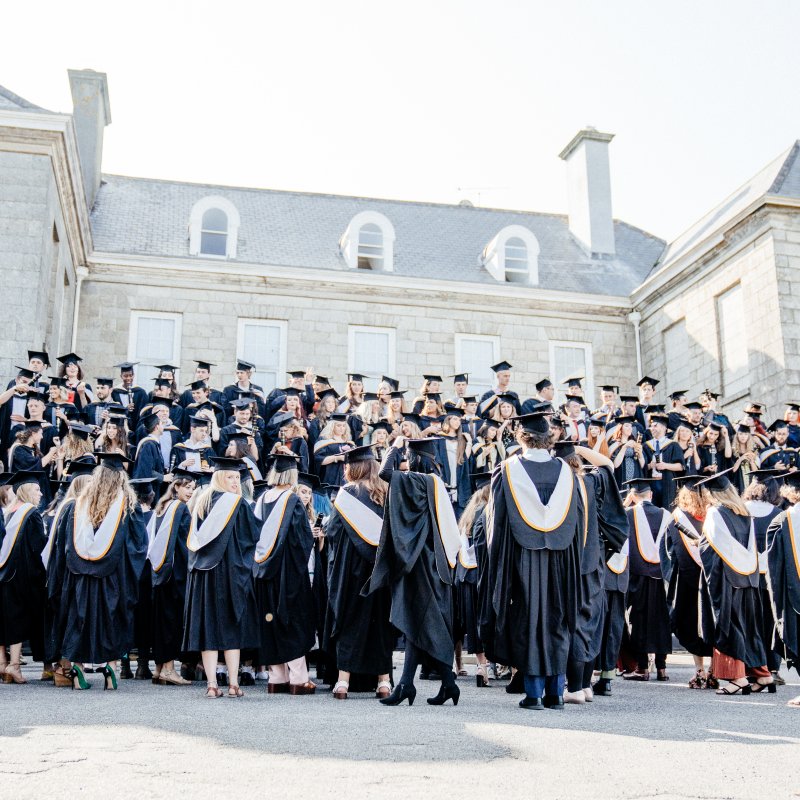 Falmouth University graduates gathering for a group photograph at Graduation 2019 