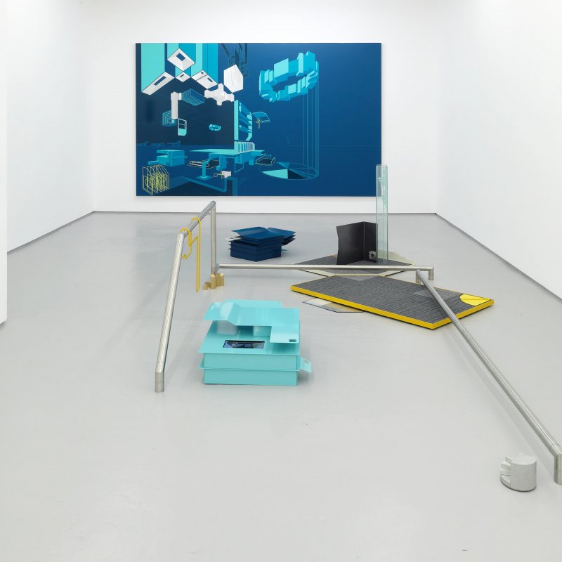 Photograph of a gallery space with a blue canvas on the wall and metal banisters
