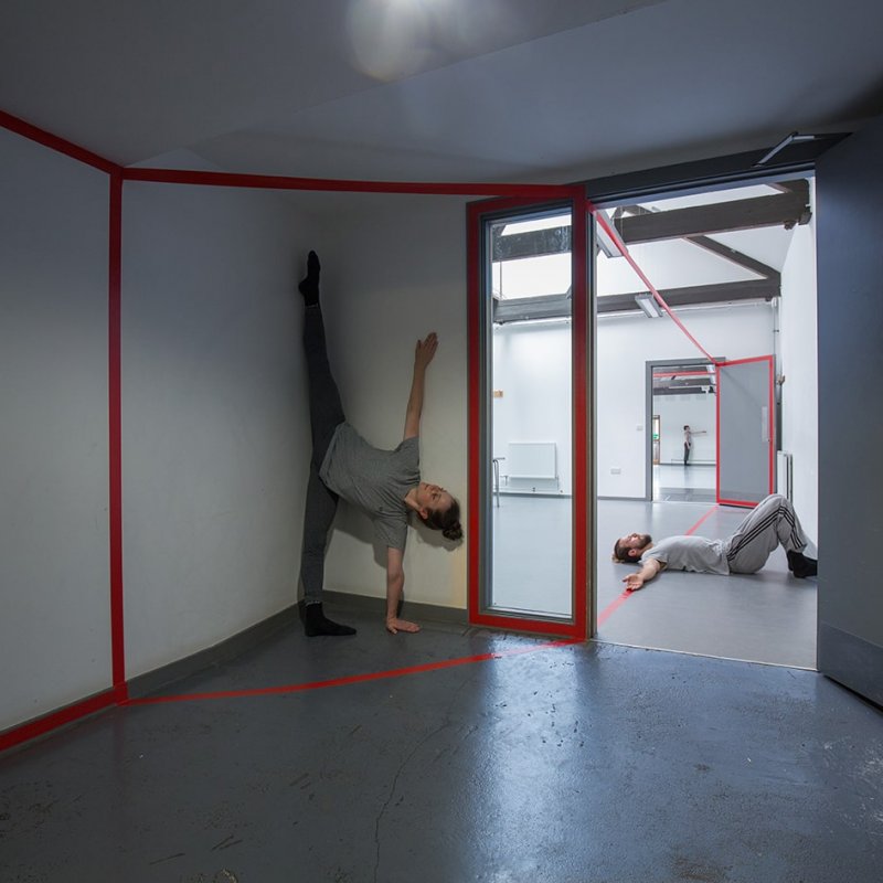 Interior rooms with dancers performing in the space