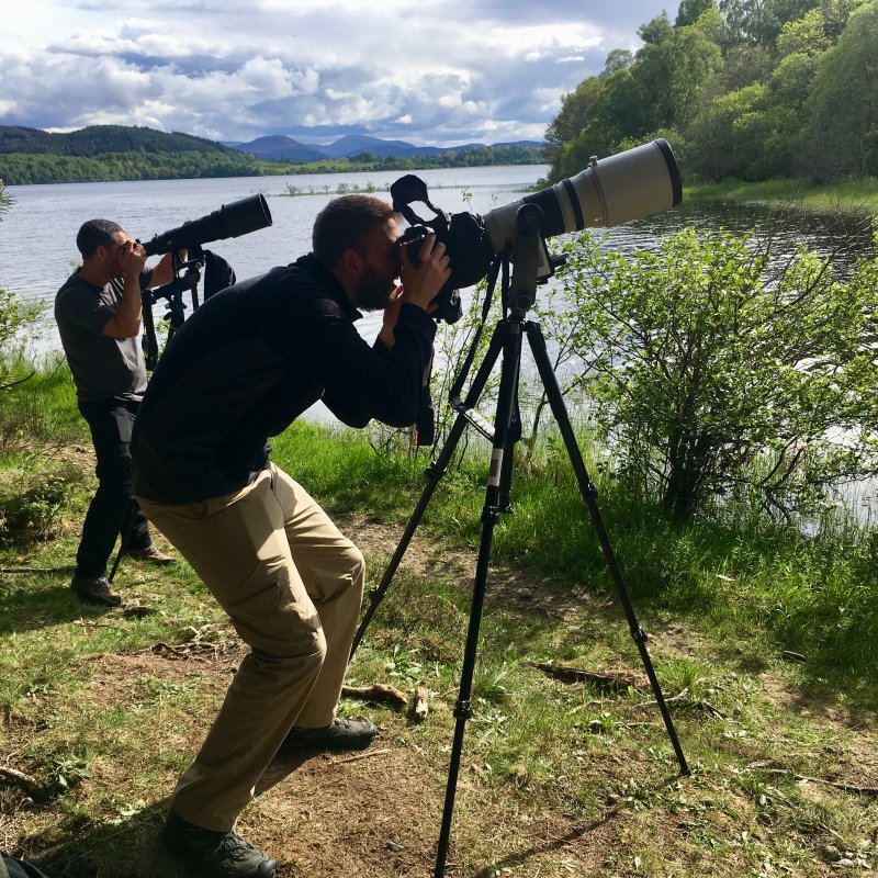 Two men with cameras on tripods