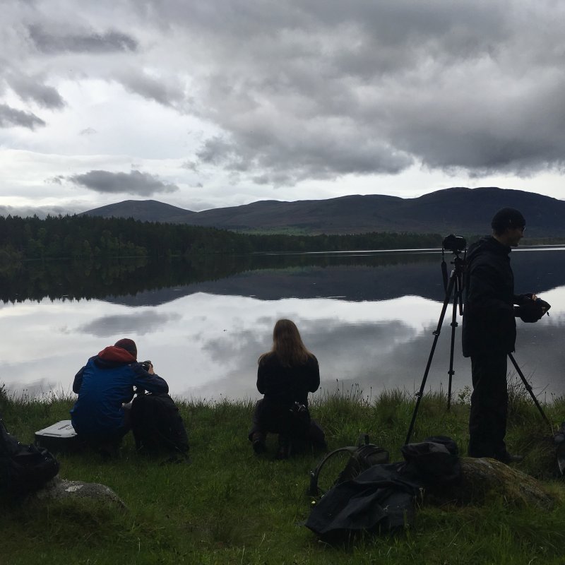 Students at the edge of a lake