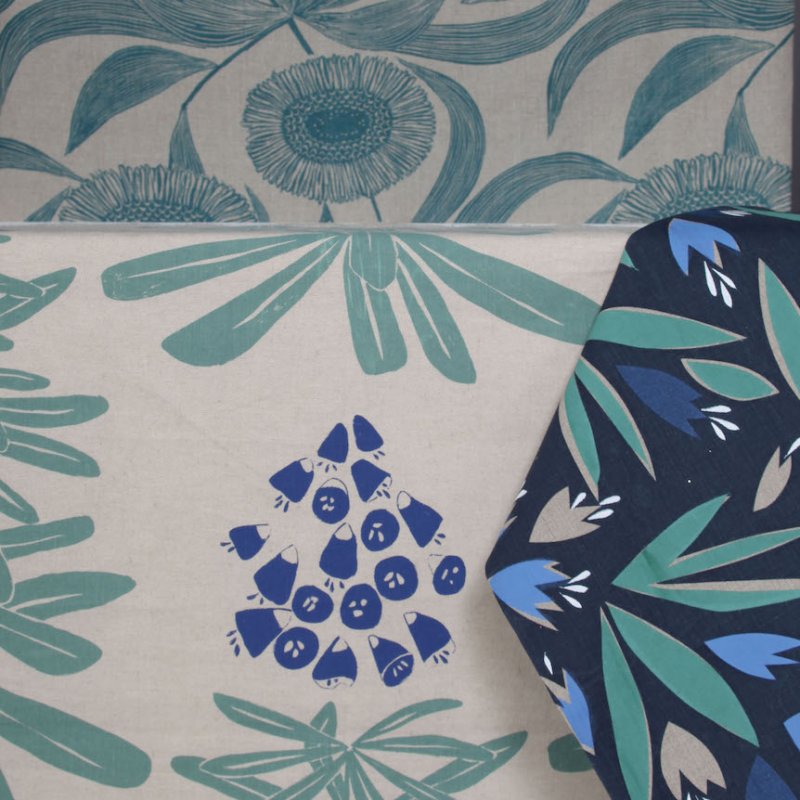 Hand printed floral fabric in green and blue.