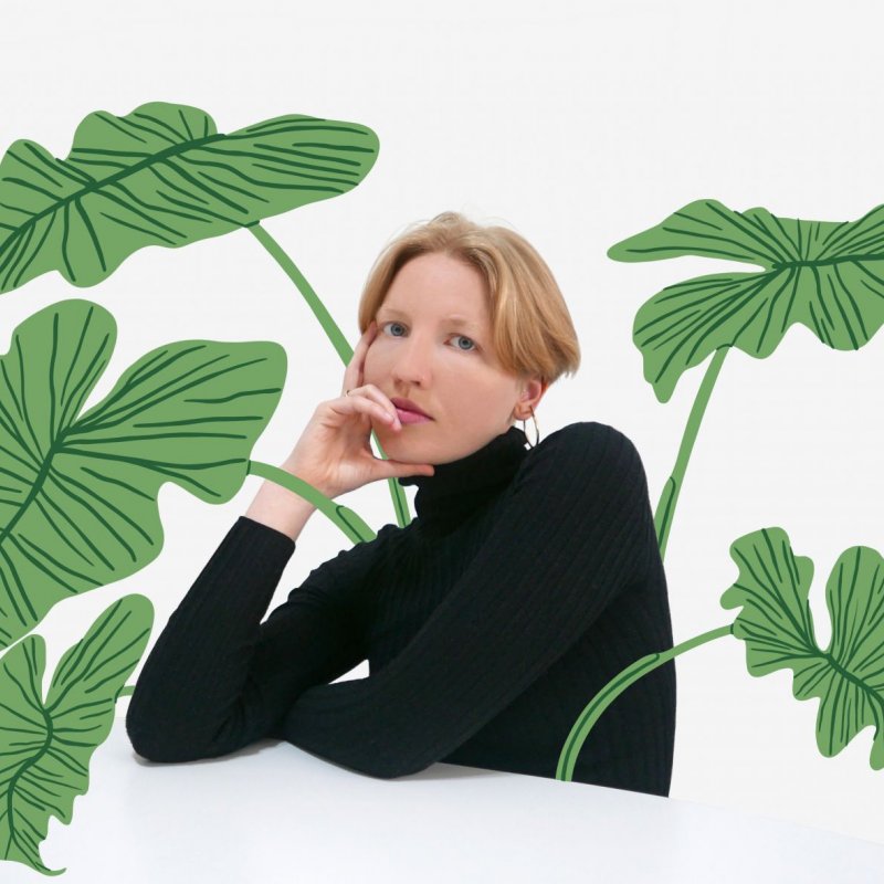 Jess Meyrick sits between leaf graphics 