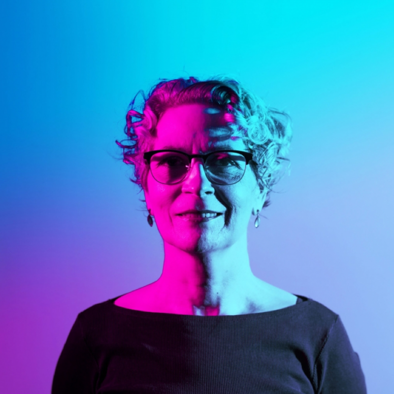 Portrait of Kitty Taylor in blue and purple light