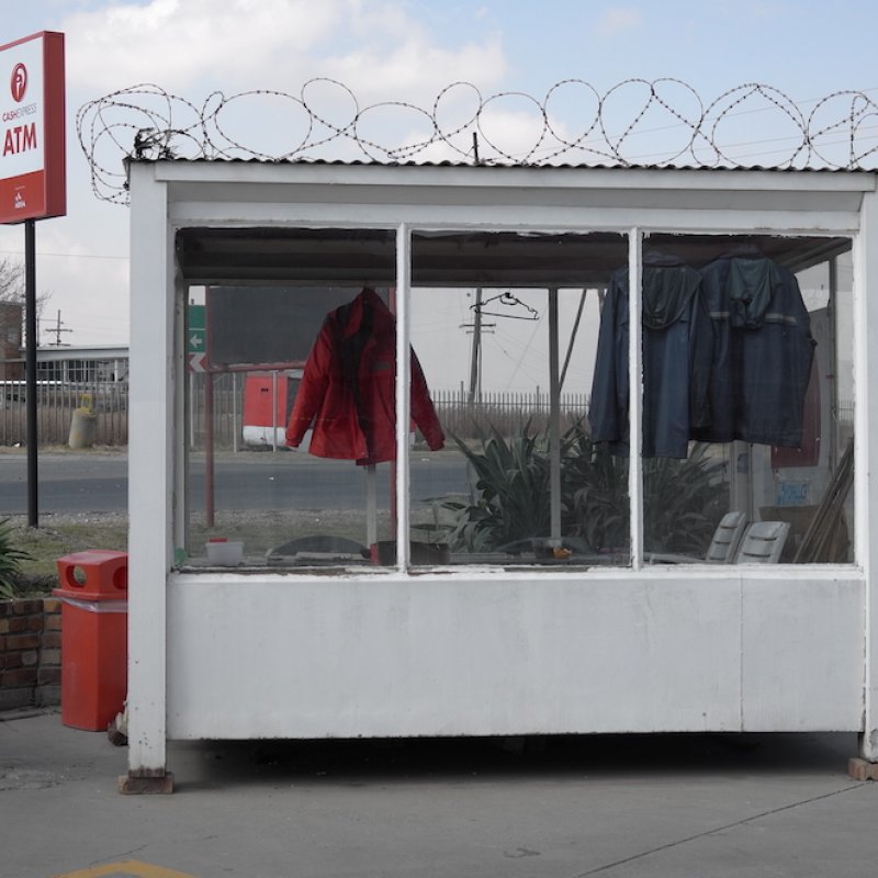 White cabin with jackets hanging inside