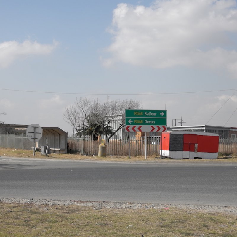 Road sign with red trailer