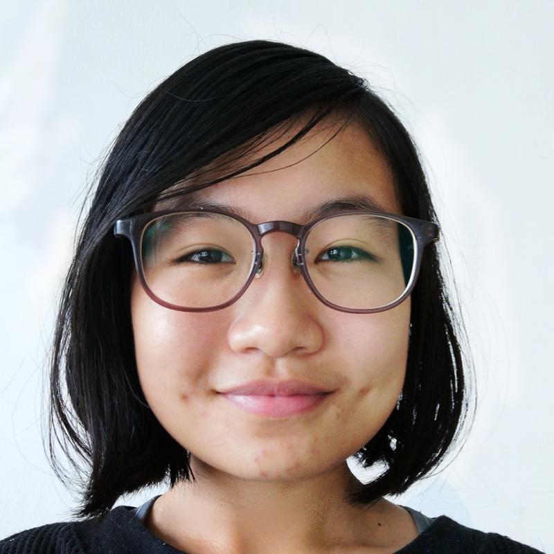 Falmouth University student with dark hair and glasses