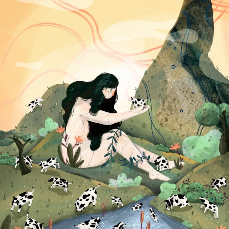 A woman is surrounded by baby cows, who are playing in a nearby stream.