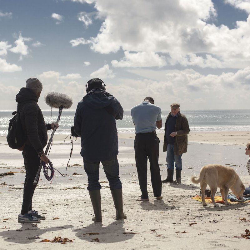 Falmouth University student film crew on beach location.