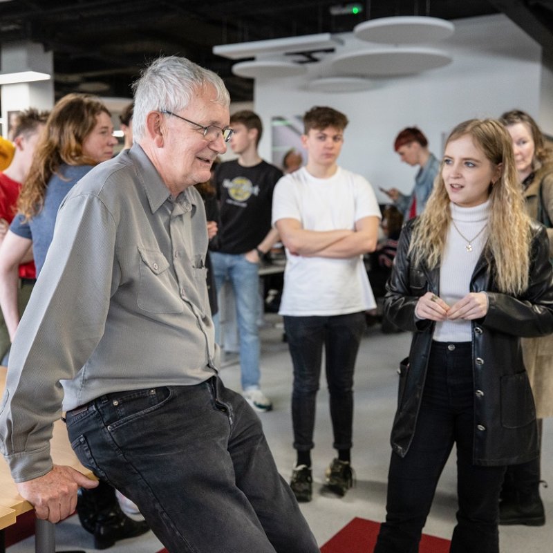 Martin Parr chatting to students