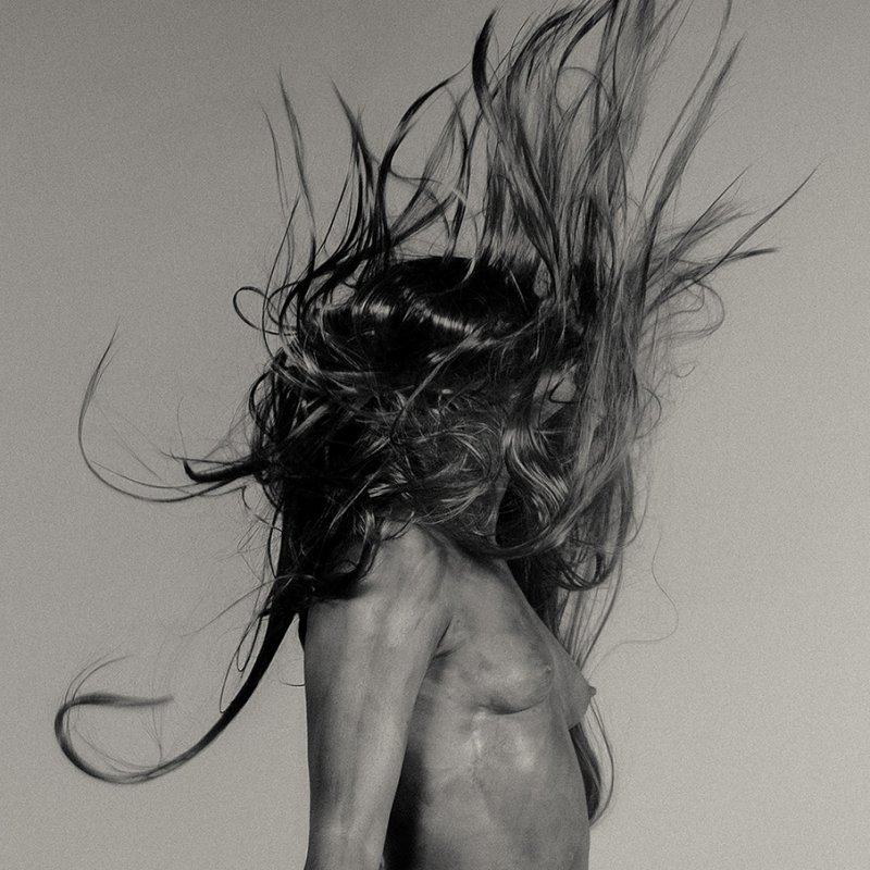topless figure with wild hair