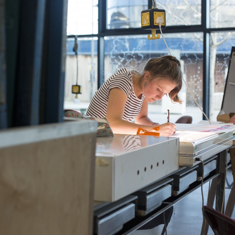 Student drawing in studio