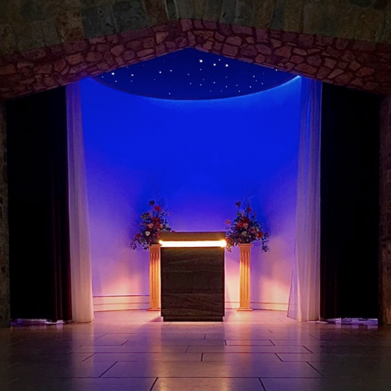 Illuminated alter with flower displays