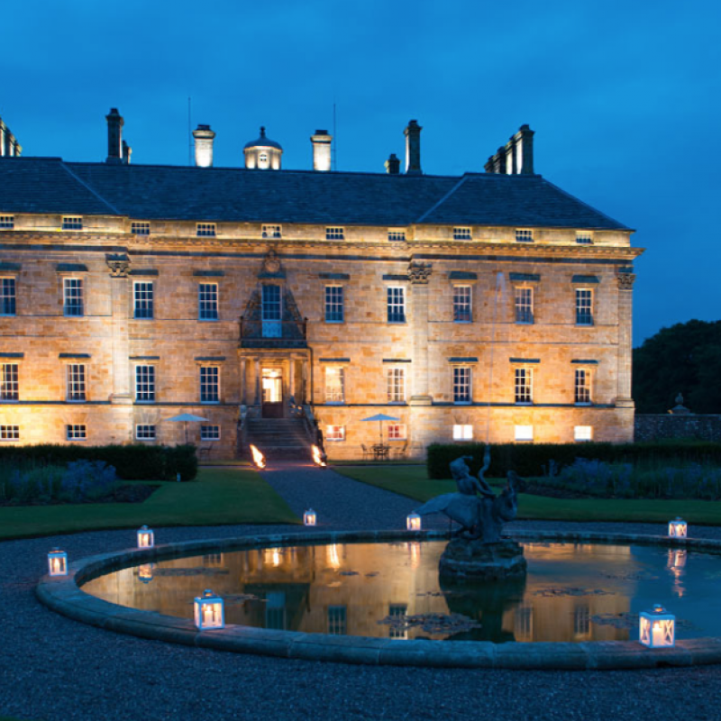 Large stately home illuminated at night