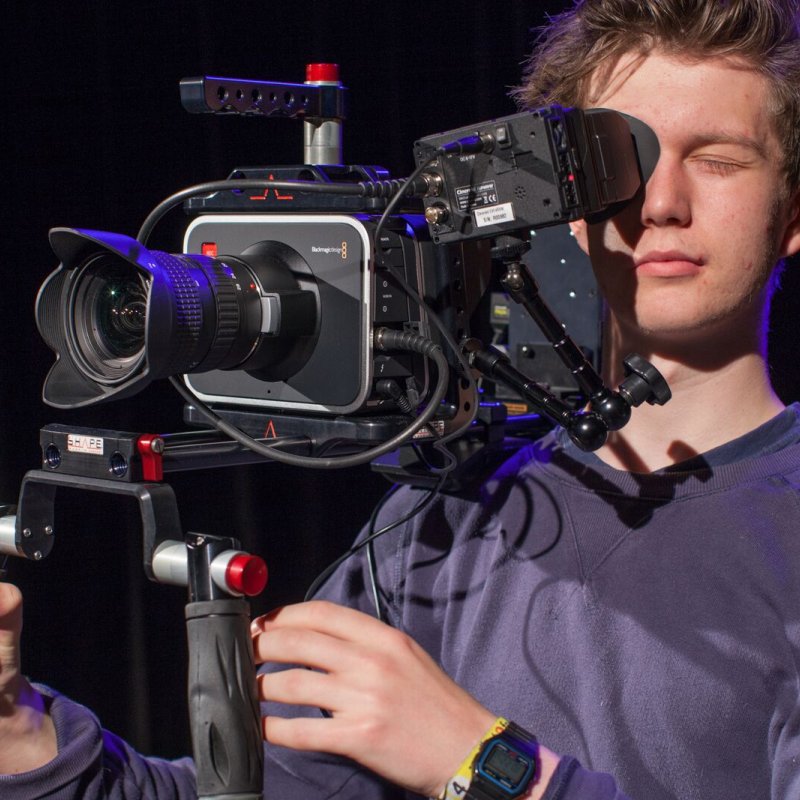 Student behind camera.